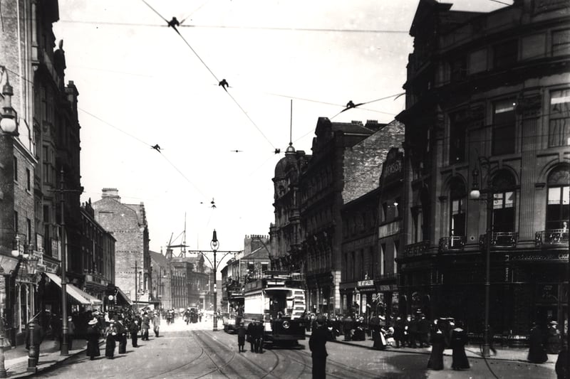 A photograph of Blackett Street Newcastle upon Tyne taken c.1903. The view is looking down Blackett Street from the junction with Grey Street.