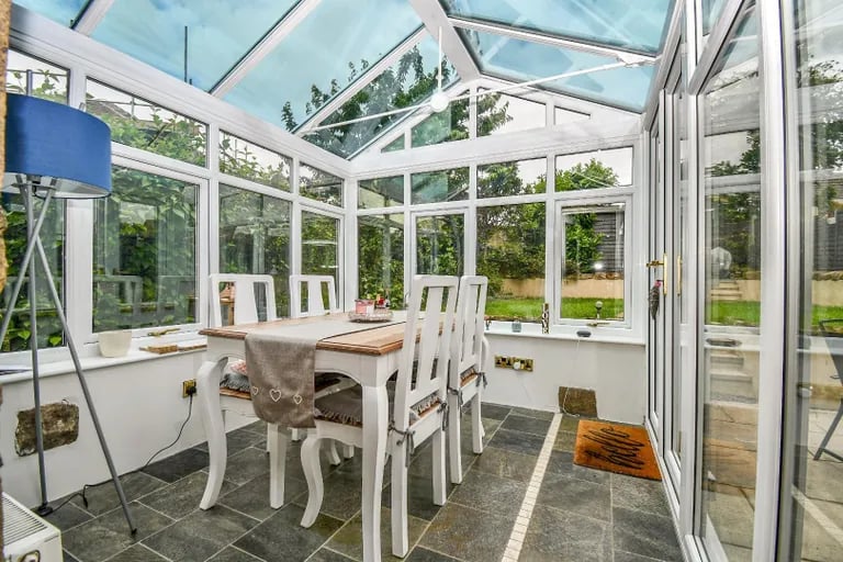 To the rear sits this stunning conservatory with panoramic views.