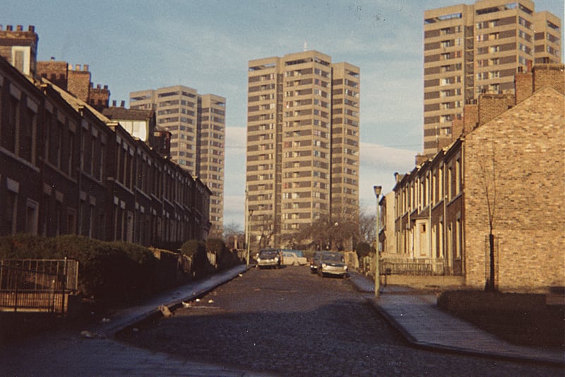 A view of Lancaster Street Elswick taken in 1975. The photograph shows three blocks of multi-storey flats at the end of a street of terraced houses.
