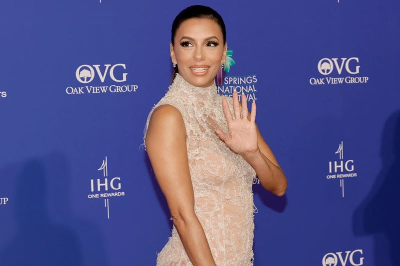 Eva Longoria looked stylish in a sheer lace gown. Photograph by Getty