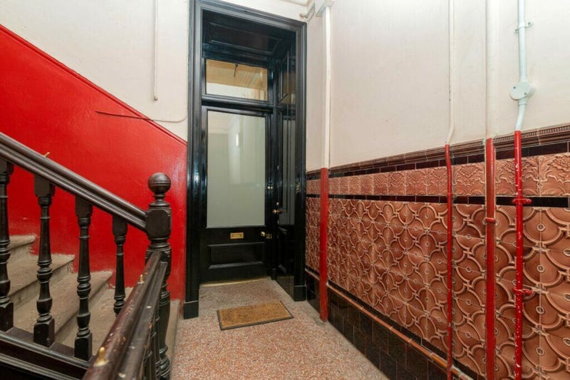 The front door entrance to the tenement flat which is found on the first floor. 