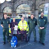 Yorkshire Ambulance Service staff outside Sheffield railway  station are: Jono Milnes (Consultant Paramedic - South Yorkshire), Esther Steele (Sheffield Station Duty Manager), Brian Fairhirst (Station Customer Service Supervisor and long-standing CFR), James Marshall (Community Defibrillation Trainer) and Warren Bostock (Community Defibrillation Officer)