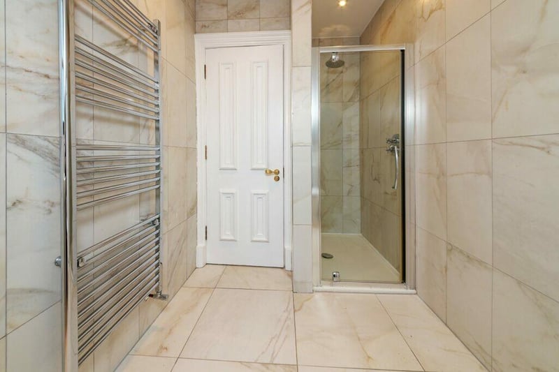 The en suite shower room is accessed from bedroom one. 