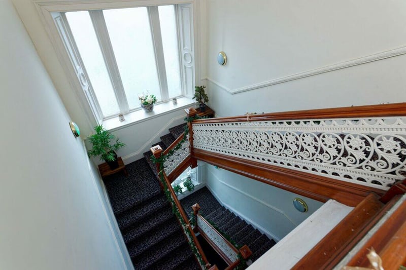 The stunning staircase leads you to the top floor flat. 