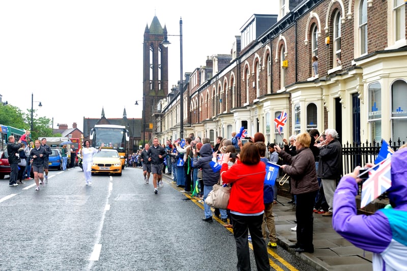 Kirstie McKeown carrying the torch along Stockton Road during the Olympic torch relay in 2012.