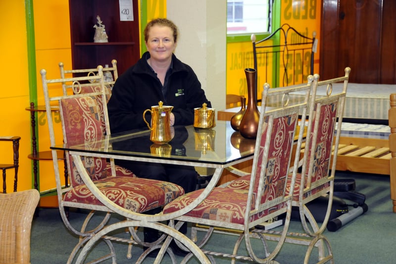 Manager Susan Dixon with a dining table set at Barnardo's furniture store in 2011.