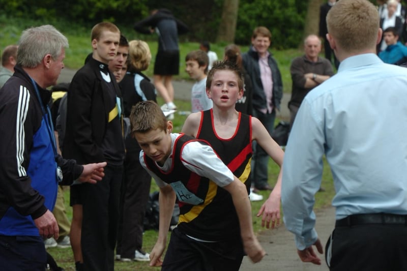 A runner finishes his race and hands over to a colleague in this scene from 2009.