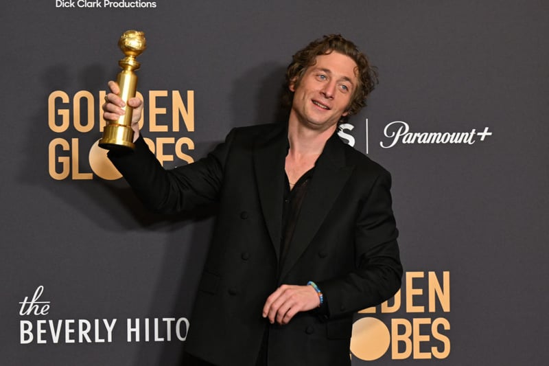 Jeremy Allen, who won for Best Performance by a Male Actor in a Television Series - Musical or Comedy  for "The Bear" looked very fashionable in a double-breasted Calvin Klein black suit