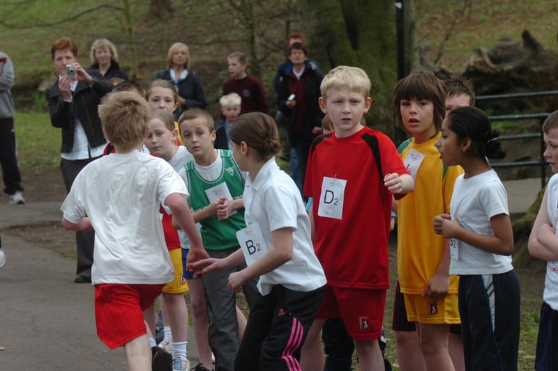 These young runners can't wait to get going in the next leg of a relay race.