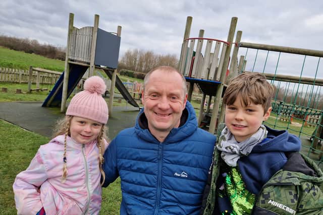 Dad Richard Beardmore with his children at the playground at Bridle Stile. Picture: David Kessen, National World