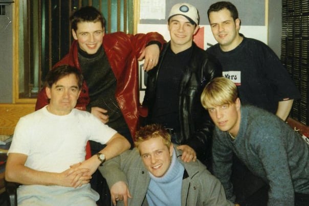 Clyde 1’s Tiger Tim (front left) and Gavin Pearson (back right) with Westlife. Gavin still broadcasts on Clyde 1 on Sunday mornings 6am - 9am. 