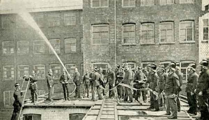 Walker and Hall's fire brigade at practice on Howard Street, Sheffield city centre, in around 1900