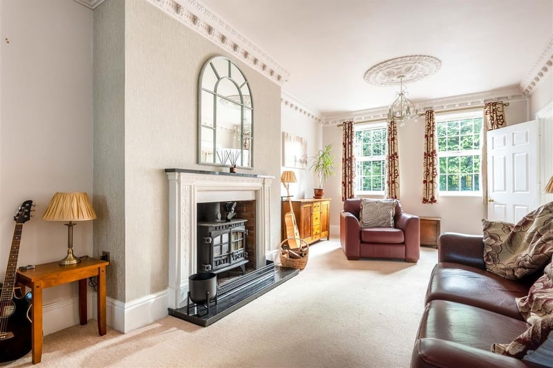 The large cosy lounge includes a feature fireplace.