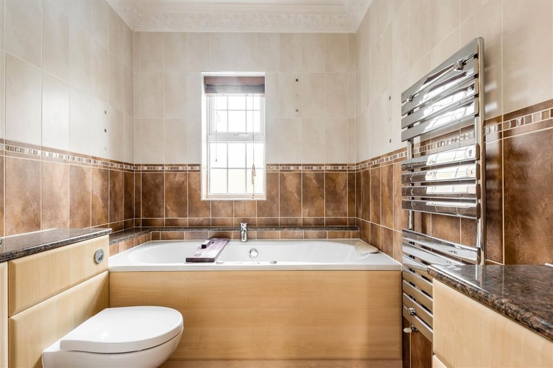 The largest bathroom, on the second floor, is decorated traditionally and includes a large bath.