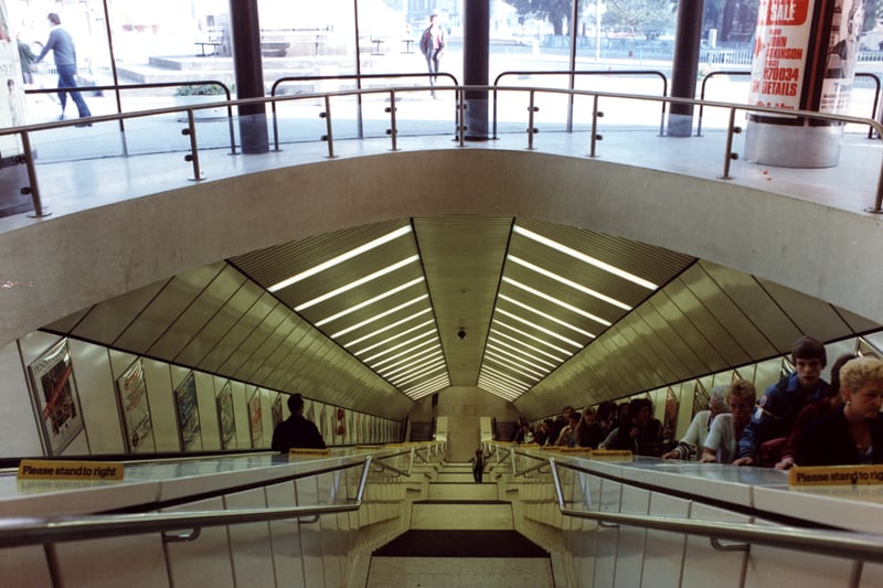 A view of Haymarket Metro Station Newcastle upon Tyne taken c.1990. The photograph shows the escalators and stairs which lead down to and from the Metro platforms. 