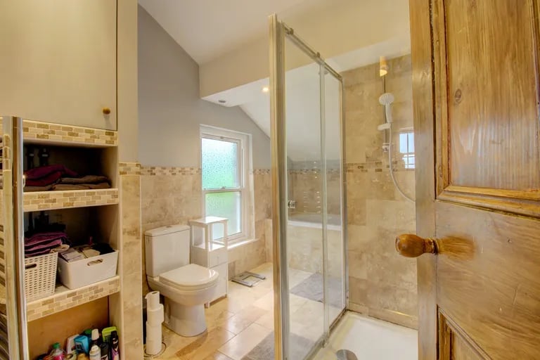 There are two bathrooms on the first floor including this with a large walk-in shower.
