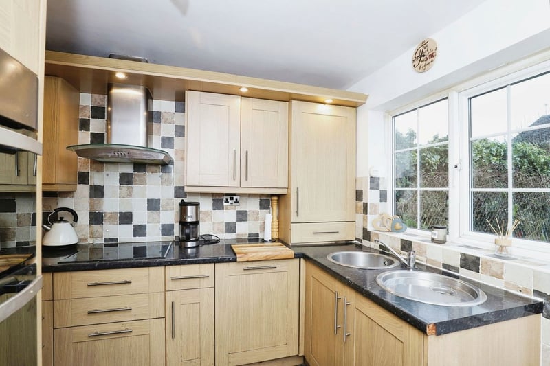 The kitchen is fitted with a range of wall and base units and has integrated appliances to include an electric hob, extractor fan, electric double oven, microwave, dishwasher and fridge/freezer.