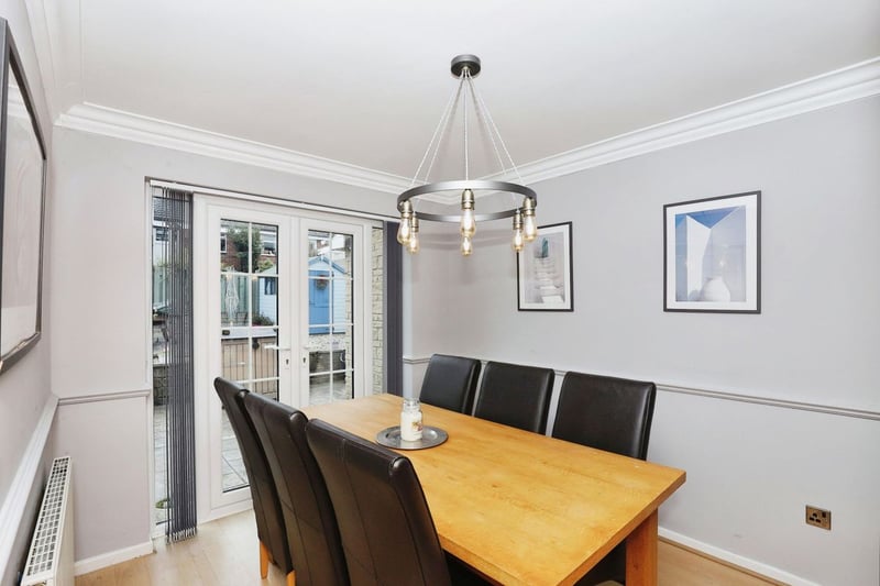 A separate dining room has laminate flooring and French style doors which lead out to the rear garden.