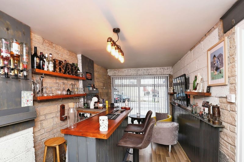 The former garage has been converted to a bar, with heating, lighting, and a cosy and homely atmosphere for the owners and guests.