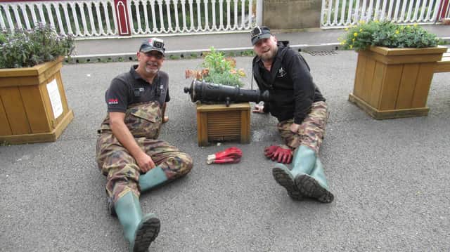 L-R Steve Forrest and Glen Collins, of The Peaky Dippers, pictured with the cannon found in the River Don in Sheffield.