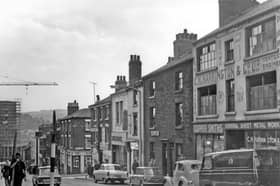 Howard Street in 1964, showing premises including C. H. Harrington and Co sheet metal workers, T.H. and N. Perkins bakers, Mary Gentle Cafe, Milners house furnishers and Globe Inn