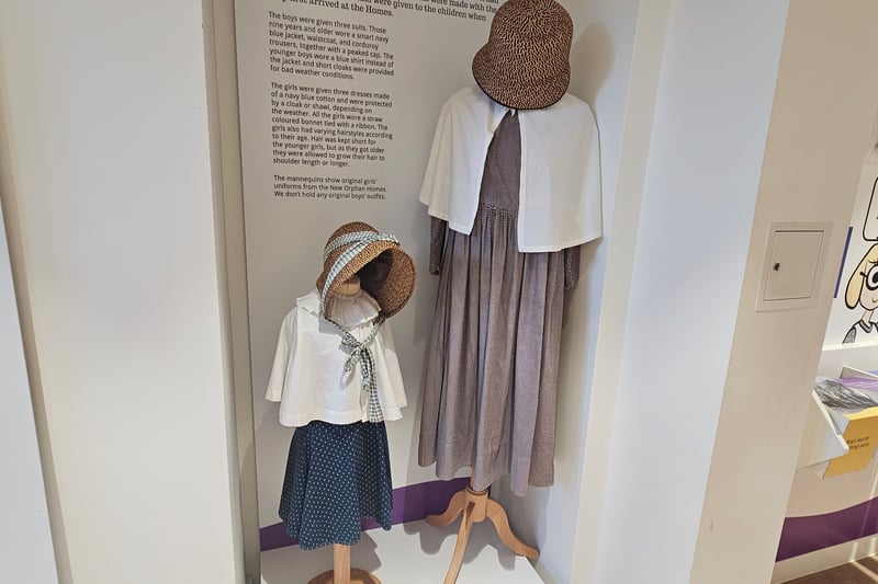 The children's daily uniforms were made with the help of the older girls and were given to the children when they first arrived at the Homes. Boys aged nine and older wore a smart navy blue jacket, waistcoat, and corduroy trousers together with a peaked cap, and younger boys wore a blue shirt instead of the jacket and short cloaks were provided for bad weather conditions. Girls wore navy blue cotton dresses and were protected by a cloak or shawl depending on the weather, as well as, a straw-coloured bonnet tied with a ribbon. Hairstyles varied according to age with young girls having short hair and as they got older, they were allowed to grow it to shoulder length or longer.
