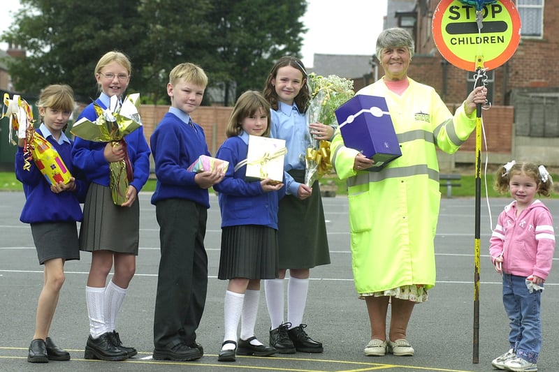 Lollipop lady Margaret Brown who retired after 35 years of helping Layton Primary School pupils across the road.
Queueing up to hand over their presents are L-R: Rebecca Blayney, Lucy Hugill, Matthew Watson, Rebecca Staff, Abigail and Maisie Cross (Margaret's grandchildren).