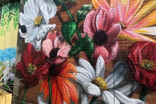 This flower mural was created by Liverpool born artist Brezaux and is located at Camp and Furnace in the Baltic Triangle.