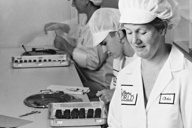 Hygiene rules meant that you could no longer have a tour of the factory, but a new visitor centre was developed instead. The photograph shows Chris Benfield and two other female employees from the demonstration production line.