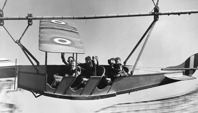 Young evacuees from Manchester and Salford enjoying themselves on the aeroplane ride pretending to bomb Berlin, at Blackpool Pleasure Beach