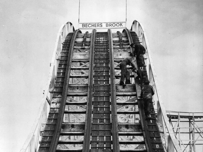 26th April 1950: Workmen preparing a stretch of the Big Dipper, called Becher's Brook, for the start of the holiday season at Blackpool Pleasure Beach