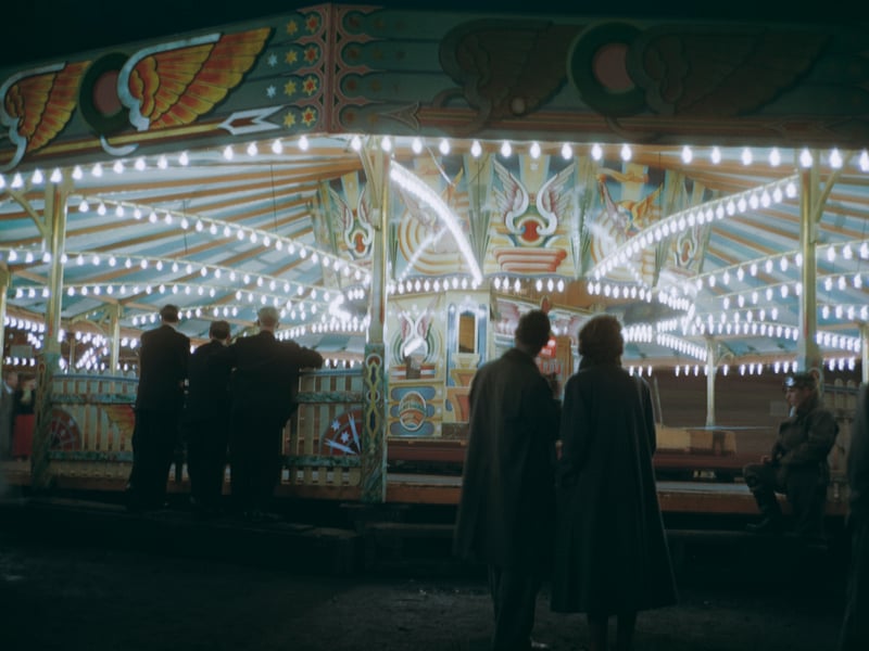 People watching the dodgem cars at night, at Blackpool Pleasure Beach, Blackpool, Lancashire, UK, circa 1955. (Photo by Hulton Archive/Getty Images)