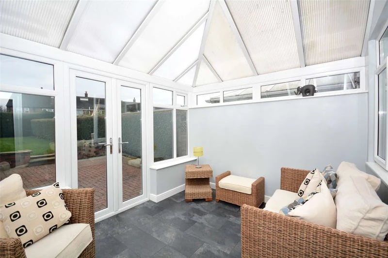 The conservatory sitting room has direct access to the rear garden.