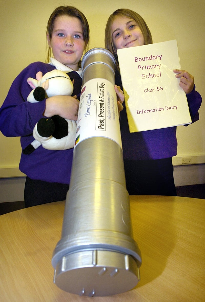 Pupils at Boundary Primary School in Blackpool have been choosing what to put in a time capsule, to be buried in a new walkway. Pictured with the capsule are Jozlin Heughan (left) and Francesca Lidgley with some of the contents