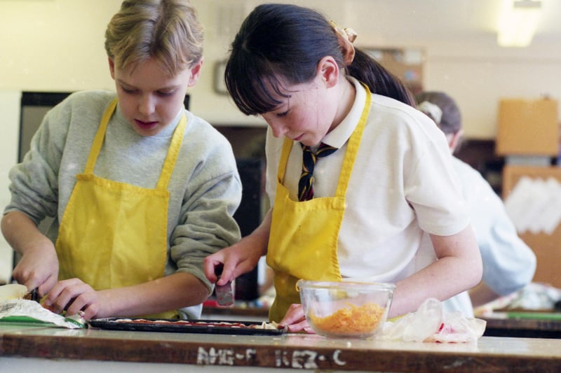 Pennywell School pupils Peter Donaghue and Leanne Dodsworth tackle the cheese savouries during a cookery course at the school in 1995.