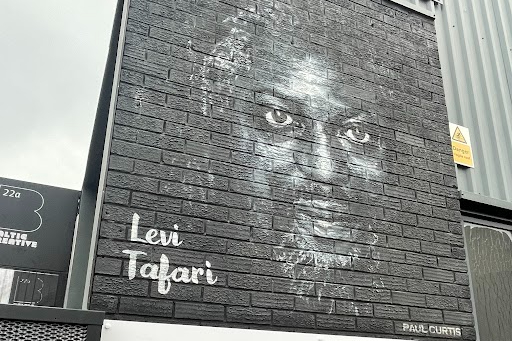 This mural was painted by Liverpool street artist Paul Curtis, in recognition of the esteemed poet Levi Tafari .It can be found in the Baltic Triangle.  
