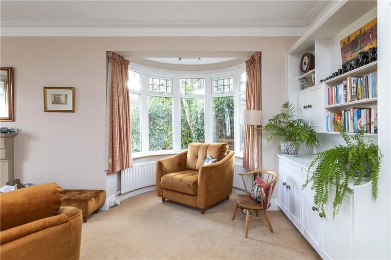 The living room has a charming bay window.