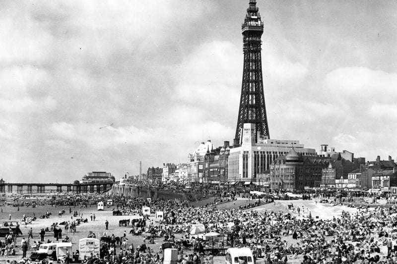 Crowds of holiday-makers on the beach at Blackpool, Lancashire, dominated by the Blackpool Tower