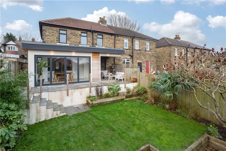 To the rear is a stunning garden with access via an elevated terrace and the overlooking dining room.