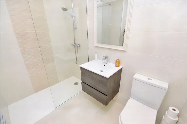 Also on the ground floor is a modern shower room with walk-in shower.