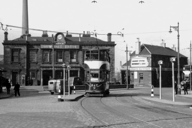 Trams drive past Haymarket station - the scene has changed a lot since this picture was taken.