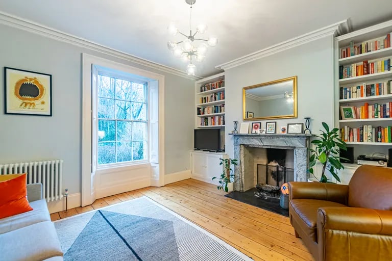 It leads to a good-size lounge with fireplace.