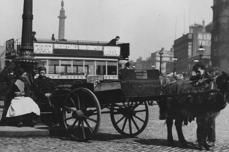 Lime Street in 1895, a pony cart is parked in front of a horse-drawn tram.