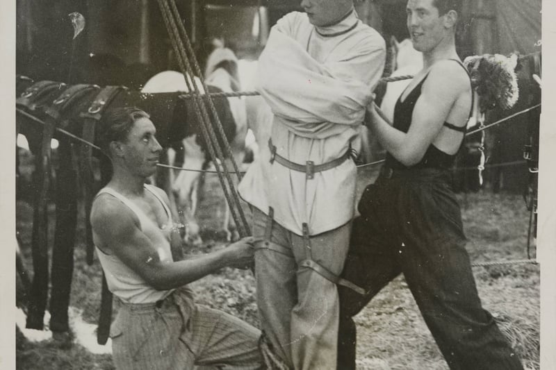 Edward C. Beck, a Cambridge undergraduate, was a member of the Magic Circle. In this picture from the 1920s shows the 23-year-old being fixed in his straight jacket ready for his act with a circus at Squire's Gate