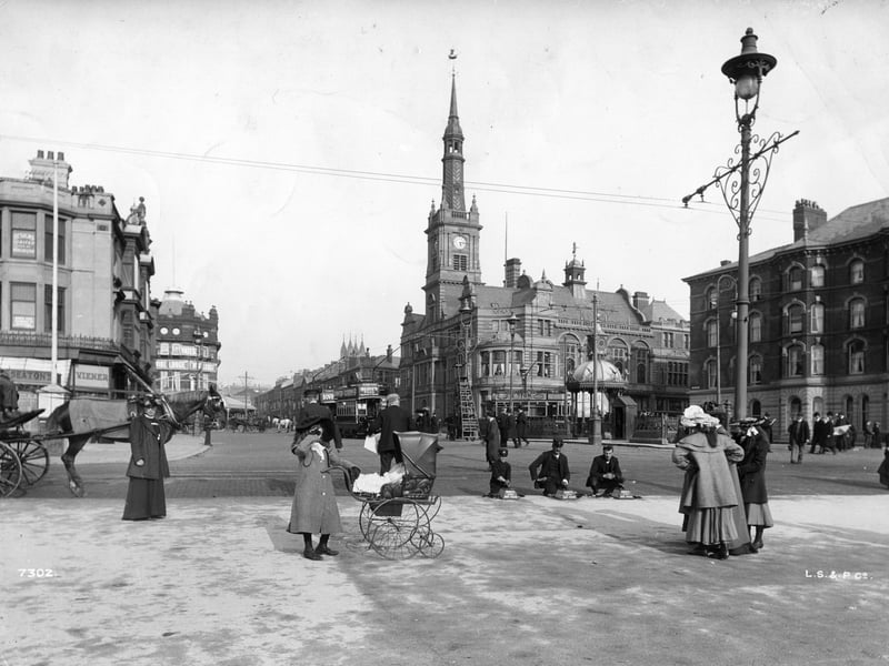 circa 1900: A child with a pram on the streets of Blackpool with the Town Hall in the background. (Photo by London Stereoscopic Company/Hulton Archive/Getty Images)