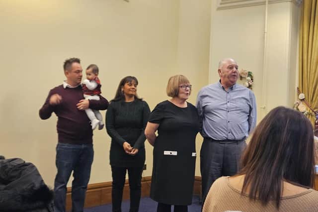 Penny Rose Hallam at her naming ceremony with her dad Craig, mum Melissa, grandmother Paula and grandfather Wilf
