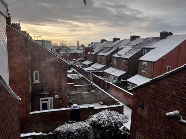 Snow has settled on rooftops across Manchester