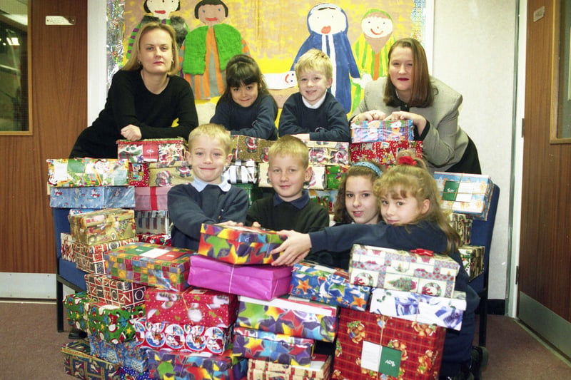 Children from Albany Primary School collected 50 shoe boxes of presents and useful items as part of Operation Christmas Child in 1998. 
Clare Jones from Reg Vardy, back right, was there to help.