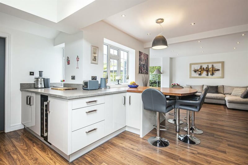 The open plan area includes a breakfasting area between the kitchen and living space.