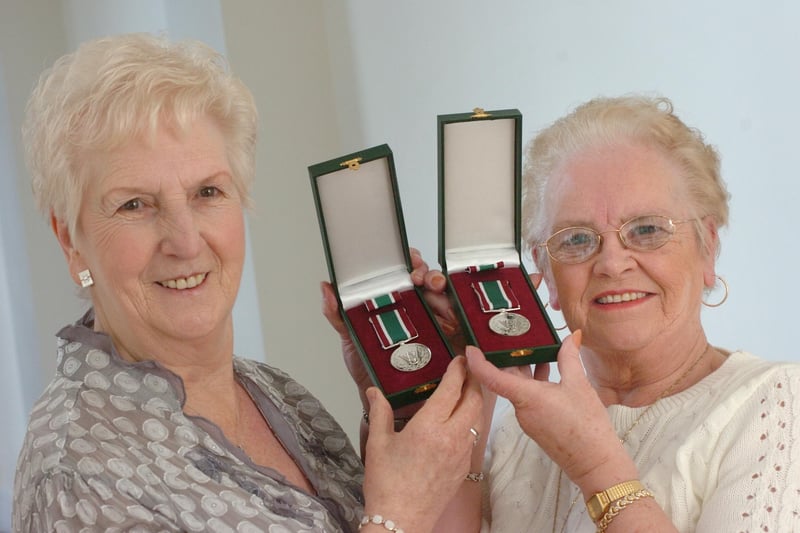 Lily Watson and Evelyn Longstaff show their long service medals in 2009.